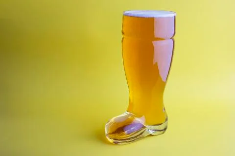 Horizontal view of a Beer boot on a Yellow background Stock Photos