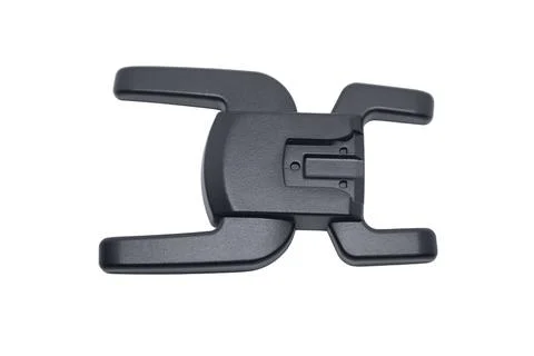 A horizontal view of a black plastic camera flash hot shoe adapter mount Stock Photos