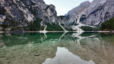 Horizontal view of clear shallow water and mountain reflection at Lake Braies. Stock-Footage 348036814