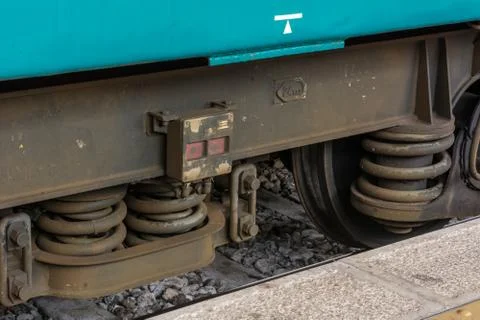 Horizontal View of Close Up of the Shock Absorbers of the Wheels of a Train W Фото