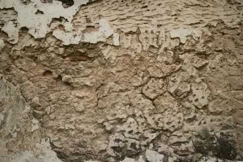 Horizontal view of Colonial stucco wall in Asia with deep fissures, erosion, Stock Photos