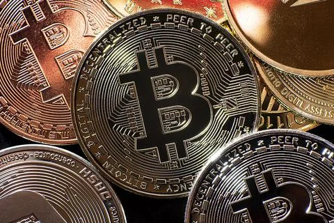 Horizontal view of cryptocurrency tokens, including Bitcoin, dogecoin, and Stock Photos
