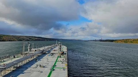 Horizontal view from the deck of a commercial merchant ship navigating thro.. Stock Photos