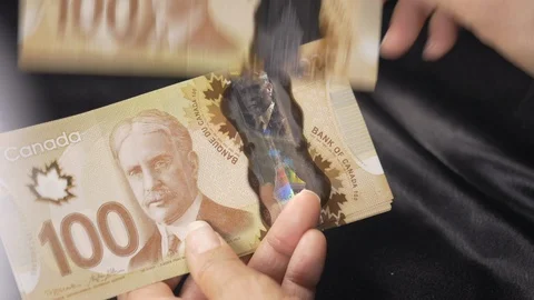 Horizontal view - a lady placing hundred dollar bills on table. 4k Stock Footage 96009571