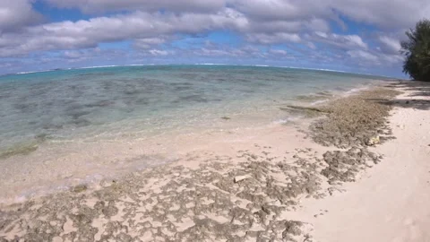 Horizontal view of look out from sandy coral reef beach in Takitumu Cook Islands Stock Footage 235318499