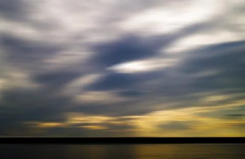 Horizontal vivid evening sunset on river motion blur abstraction Foto stock