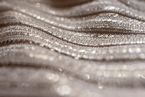 Horizontal wavy metallic background with silver-grey glitter. Fancy backgroun Stock Photos