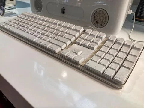 Horizontal white computer keyboard with worn keys, especially the space bar,  Stock Photos