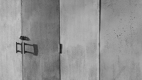 A horizontal wide angle eye level perspective captures a closed rustic text.. Stock Photos