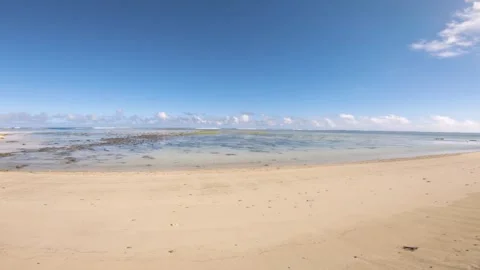 Horizontal wide angle pane view of Avaavaroa beach side with golden sand and blu Stock Footage 250472348