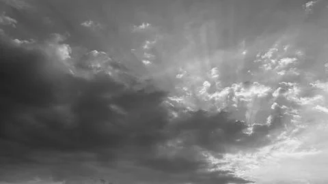 A horizontal wide angle view captures dramatic sun rays breaking through he.. Stock Photos
