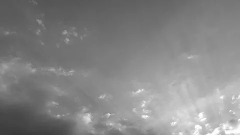A horizontal wide angle view captures dramatic high contrast cumulus cloud .. 写真素材
