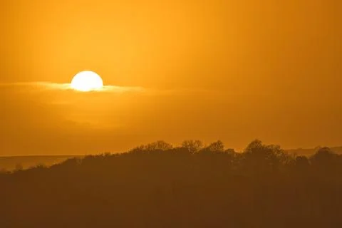 A horizontally oriented orange sunset sky Stock Photos