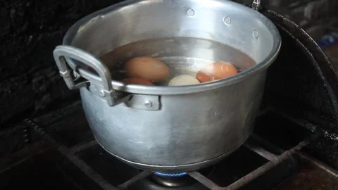 Horn chicken eggs and native chicken eggs are boiled in one pot Stock Footage 274385349