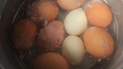 Horn chicken eggs and native chicken eggs are boiled in one pot Stock Footage 274430266
