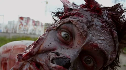 Horrible monster zombie is looking at the camera and showing hammer Stock Footage 66522645