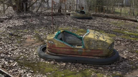 Horror of Chernobyl nuclear zone. Broken kids electric cars Stock Footage 115446820