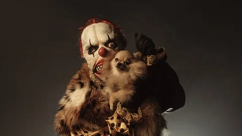 Horror clown with a dog. Stock Footage 100690477
