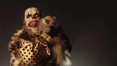 Horror clown with a dog. Stock Footage 100690761