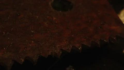 Horror concept: Detailed macro dolly of a rusty and filthy saw and bloody ropes Stock Footage 336003987