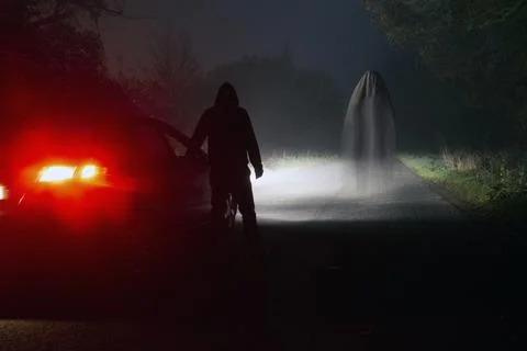 A horror concept. Of a ghost. Looking at a figure, back to camera Stock Photos