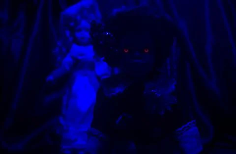 Horror dolls blue light. Stock Photos