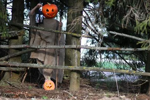 Horror pumpkin with a scythe Stock Photos
