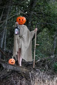 Horror pumpkin with a scythe 写真素材