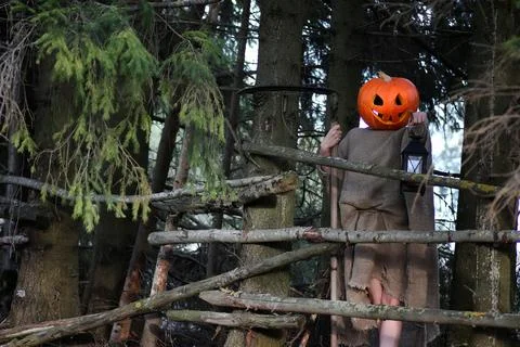 Horror pumpkin with a scythe Stock Photos