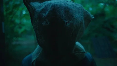 Horror scene - close up of masked man wearing scary burlap sack Stock Footage 122035612