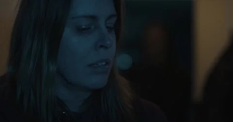 Horror scene - a dark silhouet slowly creeps up to a panicking woman Stock Footage 269506367