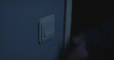Horror scene - Hand flipping light switch. A lamp in another dark room Stock Footage 263867302