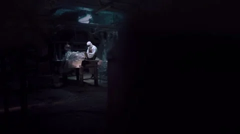 Horror scene of scientist experimenting on walking dead zombie in laboratory Stock Footage 68851023