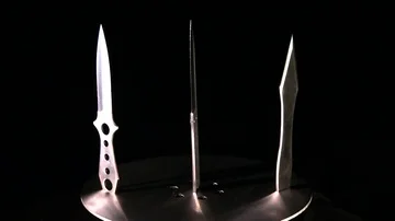 HORROR STYLE footage of a rotating knife trap -slow and hypnotic ZOOM IN- Stock Footage