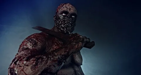 Horror zombie killer with a chainsaw and a machete. Postapokalipsis. Stock Footage 70928468