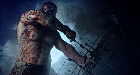 Horror zombie killer with a crossbow. Stock Footage 70933270