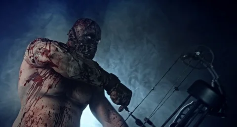 Horror zombie killer with a crossbow. Stock Footage 70933283