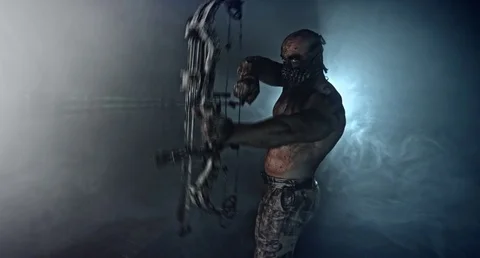 Horror zombie killer with a crossbow. 库存影片 70933547