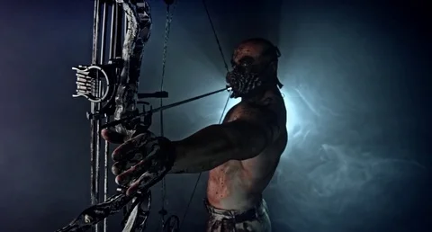 Horror zombie killer with a crossbow. Vídeos de archivo 70933644