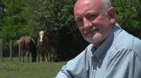 Horse farmer smiling at camera, close up Video stock 25202638