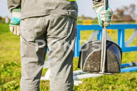 Horse handler maintaining hurdle field Stock Photos