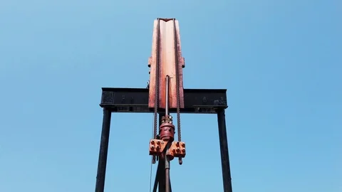 Horse head on pumpjack moving up an down, pumping crude oil. Video stock 109253103