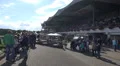 Horse Racing event tribune panning with people at sunny day HD Footage