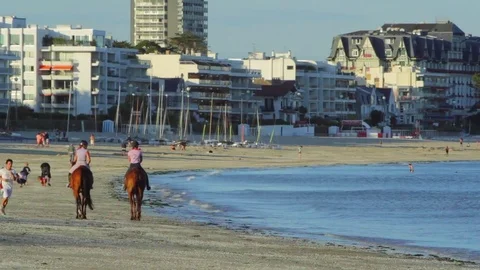Horse riding on the beach Stock Footage 74827347