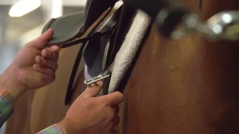 Horse Saddle Being Strapped in Place, Close Up Slow Motion Stock Footage