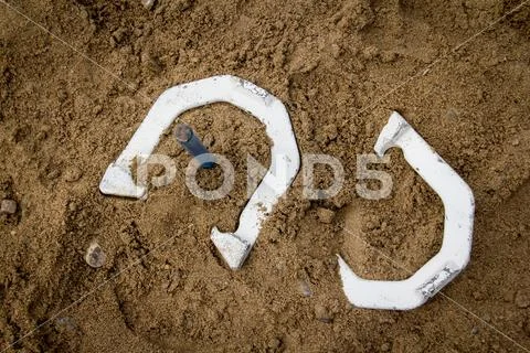 Horse shoe game on the beach Stock Photos