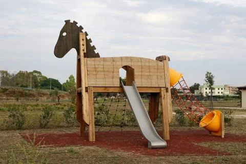 Horse with slide in the children's play area Stock Photos