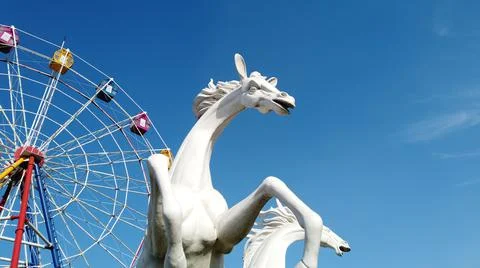 Horse statue on the sky with clouds Stock Photos