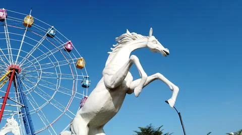 Horse statue on the sky with clouds Stock Photos