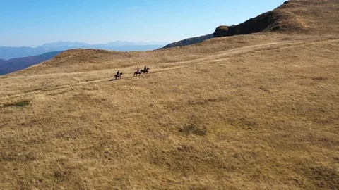 Horseback mountain riding Stock Footage 119385974